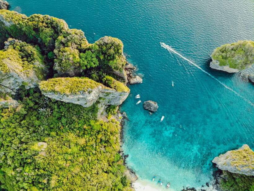 From Phi Phi: Full Day 7 Island Tour by Longtail with Sunset - Getting to the start: the Marlin Statue in Tonsai Bay