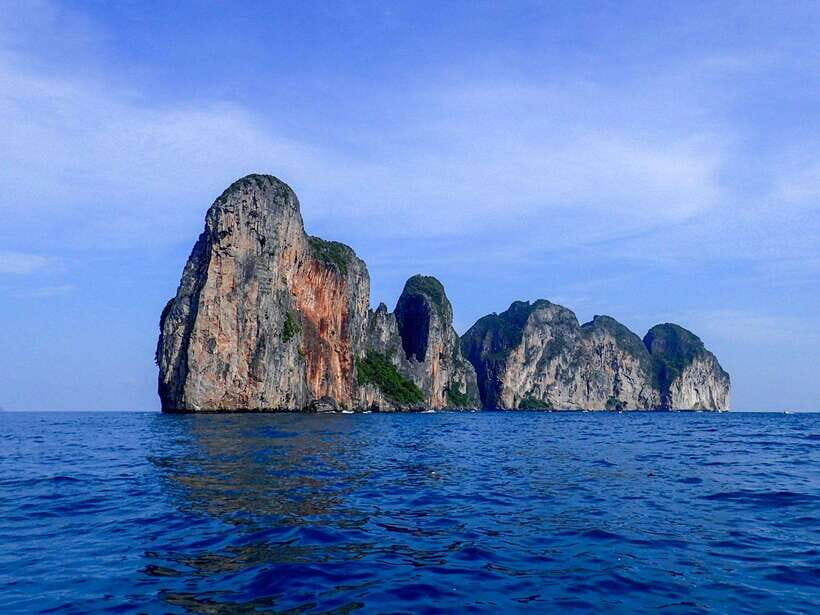 Koh Phi Phi: Maya Bay Private Longtail Boat Tour - Loh Samah Bay pass-by: quick hits of dramatic cliffs