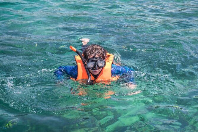 Phi Phi & Khai Islands Speedboat Tour from Phuket with Snorkeling - Phi Phi Leh and Maya Bay: cliffs, bays, and Viking Cave sightings