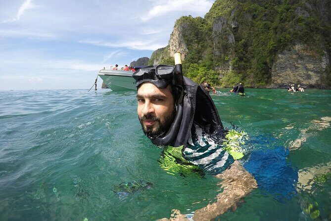 Phi Phi & Khai Islands Speedboat Tour from Phuket with Snorkeling - Phi Phi Don at 1:00 PM: lunch, a beach break, and lagoon-style swimming